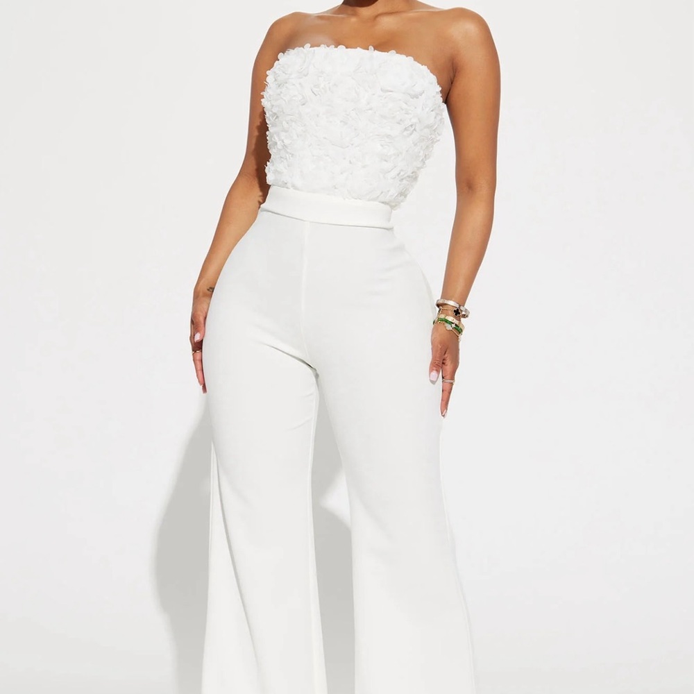 White strapless jumpsuit with form-fitting design and full-length legs